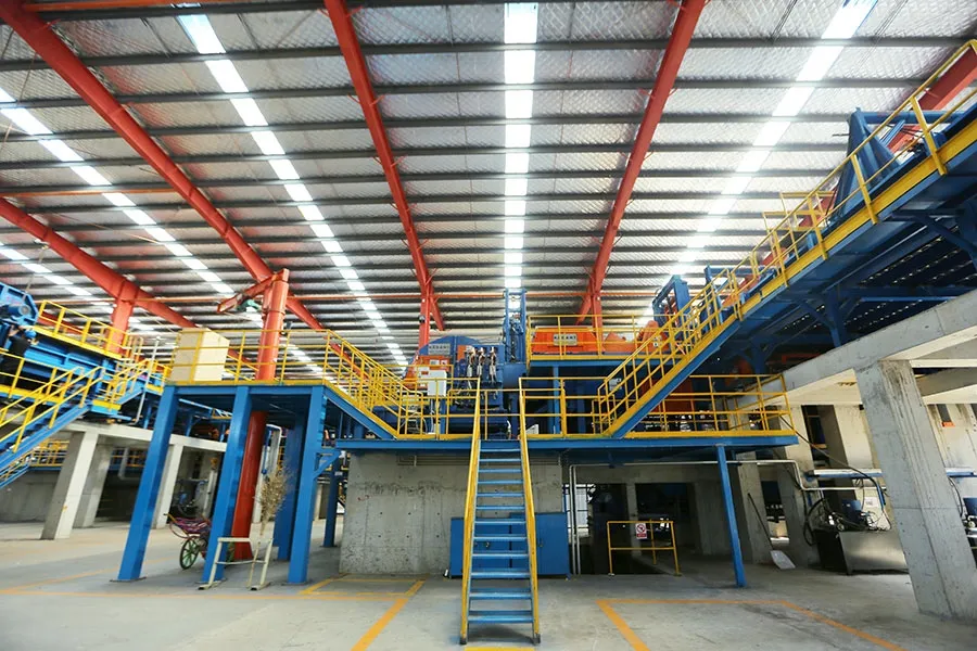 Workers on a raw-material handling platform above intake equipment