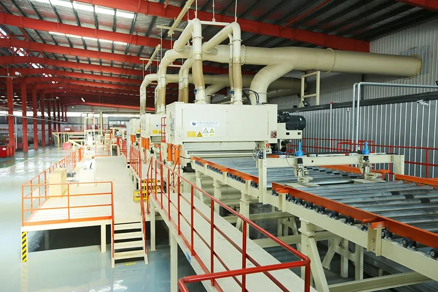 Sanding and finishing line under a mezzanine walkway on a Ningfeng production line